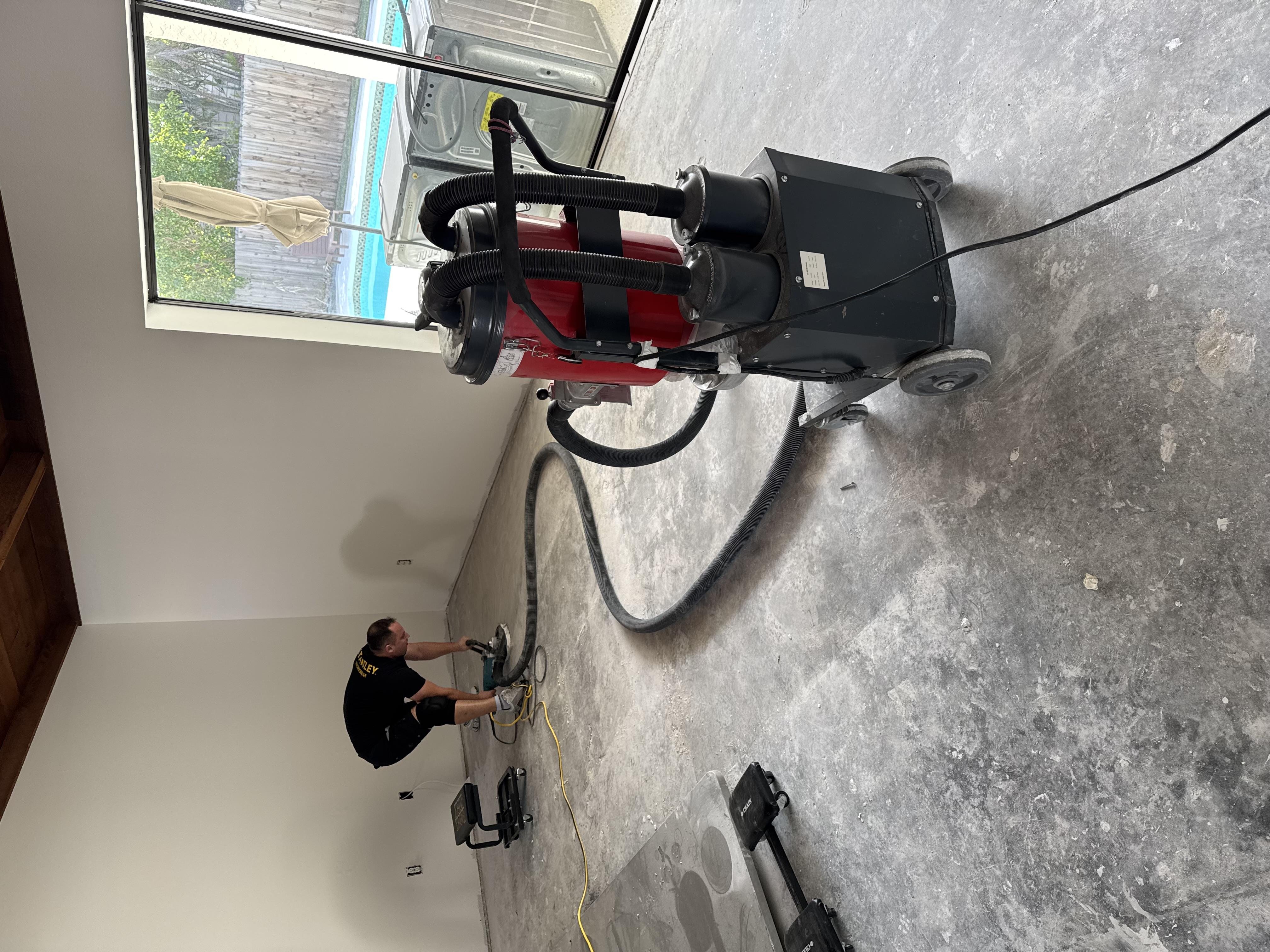 Concrete floor prep and grinding before flooring install in a Roseville, CA home