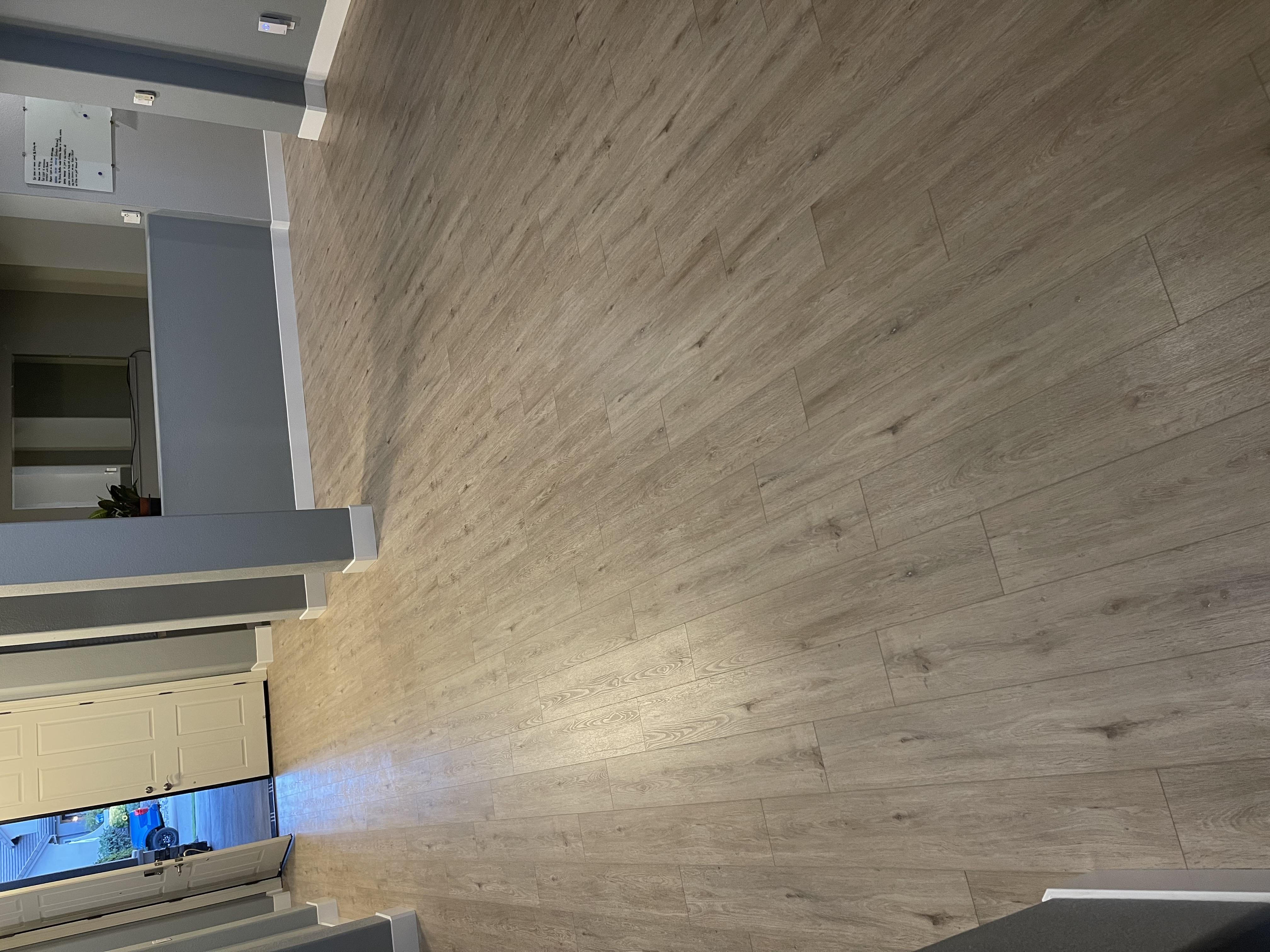 Light oak luxury vinyl plank hallway installation in a Rocklin, CA home
