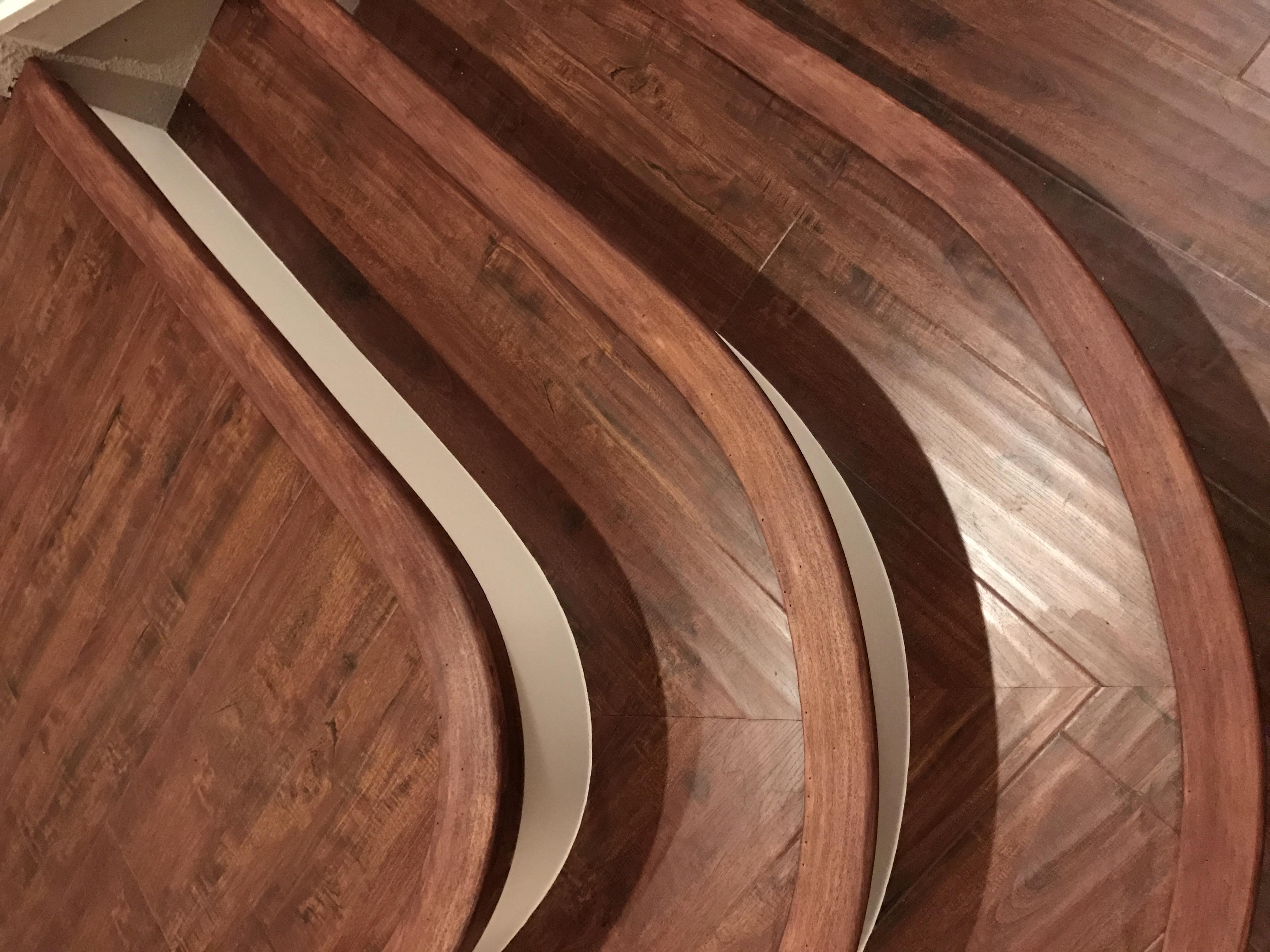 Mahogany-stained curved stair treads in a Lincoln, CA home